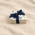 Coaster stack on soft linen background