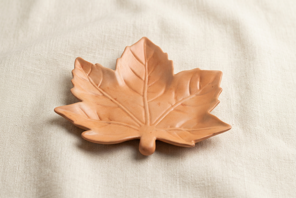 Maple leaf dish, elevated angle, on ivory linen