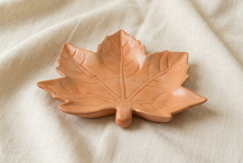Maple leaf dish, low angle, on ivory linen