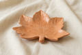 Maple leaf dish, low angle, on ivory linen