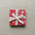 Snowflake coaster on linen background
